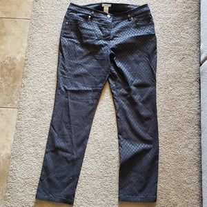 Black trouser pants with a textured sheen.